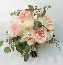 Loose And Natural Garden Roses And Hydrangea Are Accented With Trailing Seeded Eucal Pink Wedding Flower Bouquets Bridal Bouquet Flowers Rustic Bridal Bouquets