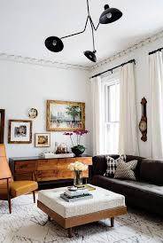 Neutral Living Room Design Featuring White Walls And Curtains A Dark Gray Contemporary Sofa A Large Off Wh Eclectic Living Room Room Inspiration Living Decor