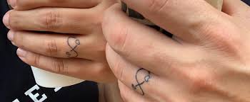 This wedding ring tattoo has the roman numerals '7' etched on it. Wedding Ring Tattoo Ideas Popsugar Beauty