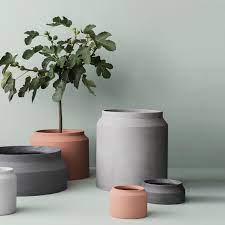 Create a cohesive design by using flowers from one color family. Ferm Living Pot Ferm Living Huset Modern Scandinavian Design Concrete Plant Pots Cement Flower Pots Large Outdoor Planters