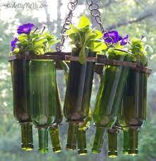 Growing flowers in wine bottles. Wine Bottle Hanging Basket Container Gardening Flowers Gardening How To Repurposing Upcycling Wine Bottle Planter Diy Garden Projects Wine Bottle Garden