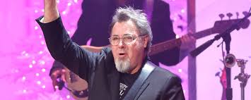 Vince Gill, the “Nicest Guy in Nashville,” Once Taunted a Crowd of Raging KISS Fans - American Songwriter