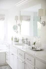 15% coupon applied at checkout. A White Framed Vanity Mirror Is Lit By Two Polished Nickel Sconces Mounted To The Mirror S Fram Bathroom Countertops Custom Bathroom Vanity Bathroom Sink Decor
