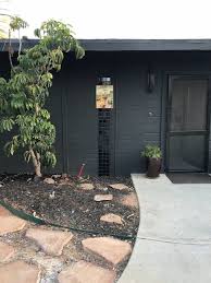 Black brick exterior home ideas. Modern Ranch Black House Wood Trim Hometalk