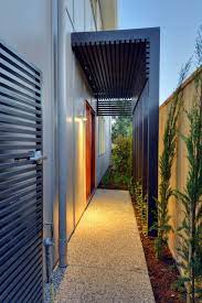Architect ray booth of mcalpine used a louvered screen in the entry of a 1961 houston house to replace an old '60s room divider. Pin By Maggie Matthews On New House Outdoor Pergola Patio Outdoor Pergola Entrance