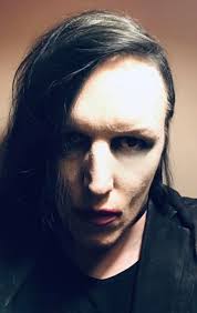 I have had my Hair dyed I was taking photos I looked back seen this one  then I remembered the Antichrist Superstar photo I used a graphics program  to edit my photo