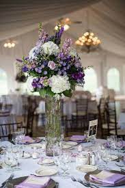 Ftd offers a wide selection of wedding flowers to say congratulations or thank you for the invite, to be used as centerpieces at a rehearsal dinner, for the bride to hold while she walks down the aisle, or any other wedding need you may have. Follow Us Signaturebride On Twitter And On Facebook Signature Bride Magazine Purple Wedding Flowers Centerpieces Purple Wedding Flowers Purple Centerpieces