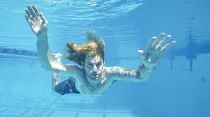 Nevermind is the second studio album by american rock band nirvana, released on september 24, 1991, by dgc records.produced by butch vig, it was nirvana's first release on the dgc label, as well as the first to feature drummer dave grohl. The Nirvana Nevermind Album Cover Baby Recreates The Picture 25 Years On Bbc News