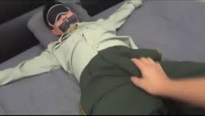 A armed police officer bound to a bed - ThisVid.com