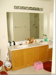 Remodelaholic Framing A Large Bathroom Mirror Bathroom Mirror Makeover Large Bathroom Mirrors Bathroom Mirror