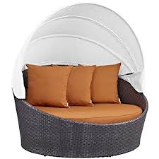 This patio set includes a spacious curved sofa with a matching ottoman. Round Outdoor Patio Daybeds