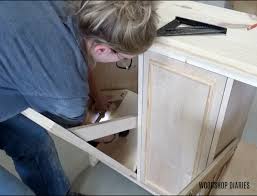 Diy pull out laundry hamper. Diy Tilt Out Laundry Hamper Cabinet Free Building Plans And Video