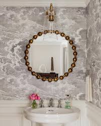 round gold leaf mirror with oval