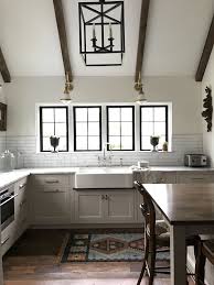 Buyers have a vast choice of materials and varieties to select from to create the most artistic and functional sanitary systems. English Kitchen With Beams Vaulted Ceiling Casement Windows Apron Front Farm Sink White Marble Reclaimed Wood Flo Home Decor No Upper Cabinets Chic Kitchen