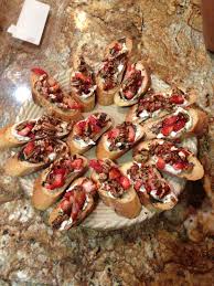 Chrissy S Crostini S Sliced Baguette Toasted With Olive Oil Trader Joes Honey Goat Cheese Chopped Candied Balsamic Reduction Candied Pecans Sliced Baguette