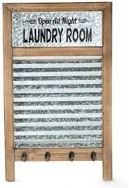 Wall art décor has many forms, including the metal wall art, which we will back to in an instant. Amazon Com Emax Home Large Farmhouse Metal And Wood Washboard With Towel Hooks For Laundry Room Vintage Laundry Room Wall Decor Sign With Galvanized Memo Board 24 75 X 15 Home Kitchen