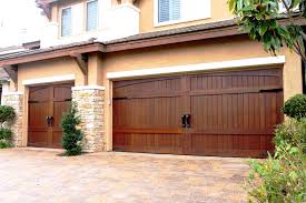 Simple carriage style hardware for garage doors. Stain Grade Custom Wood Garage Doors Garage Doors Unlimited