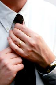 Hands Of A Married Man Straighten His Tie In Preparation For Work A Date A Meeting An Interview Etc Prominent D Wedding Rings Wedding Guide Wedding Bands