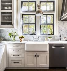 Black Trim On The Windows Apron Front Sink White Shaker Cabinets Windows And Pendant Over T Shaker Style Kitchen Cabinets Kitchen Trends Kitchen Cabinets