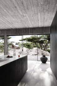 Contemporary Home With Bare Concrete Walls And A Black Kitchen Concrete Interiors Traditional Interior Design Contemporary House