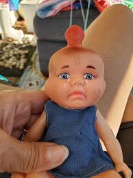 Old, creepy doll found in a box, potential restoration and value