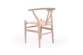 The frame is of black steel. Wishbone Designer Replica Chair White Coastal Oak Abide Interiors