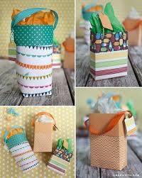 All it takes is a little bit of strategic folding, some tape and some string the next time you need a little gift bag for a small present, don't run out to the store. Make A Custom Gift Bag Out Of Scrapbook Paper
