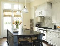 Black quartz is a unique countertop that has stunning designs with black handles and a dark wood floor. Blue Kitchen Island Transitional Kitchen Berkley Vallone