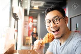 Check spelling or type a new query. Funny Face Of Asian Man Eat Fried Chicken In The Franchise Cafe Stock Photo Picture And Royalty Free Image Image 120054257