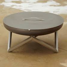 The size of the fire pit table measures about 21.7x 41.26 x 41.26 inches and the color of the fire pit table is earth tones, which provides an attractive look and the weight of the product is about 162 pounds, and this can be the best product for enjoying the evening with your friends and families. Wood Burning Fire Pit Lid Curonian Stainless Steel Carbon Steel Contemporary