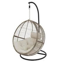 Hampton Bay Brown Wicker Round Outdoor Patio Egg Lounge Chair Swing With Biscuit Tan Cushions 65 18246a The Home Depot In 2021 Swinging Chair Patio Swing Resin Wicker Patio Furniture