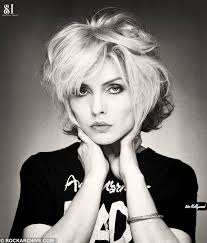 Happy 79th Birthday to Debbie Harry! Deborah Ann Harry (born Angela  Trimble; , 1945) is an American singer, songwriter and actress, best known  as the lead vocalist of the band Blondie. Four