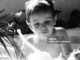 Boy And The Water Stock Photo