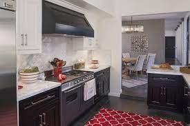 Multihued dishes add another burst of color on open cabinet shelves. Black And White Kitchen With Red Accents Hgtv