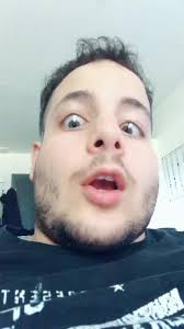 Person in Black T-Shirt with White Graphics