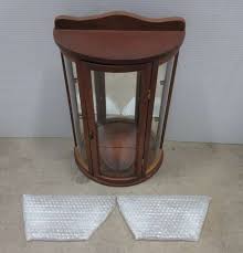 Three interior shelves offer plenty of storage for crisp towels, toiletries, and. Albrecht Auctions Small Curio Cabinet Wood With Glass Panels Door Opens In Middle Front Two Glass Shelves And 2 Hanging Clips