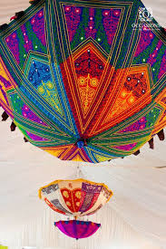 How To Use Umbrellas For Wedding Decor In A Fun Quirky And Chic Way Umbrella Decorations Mehndi Decor Indian Wedding Decorations
