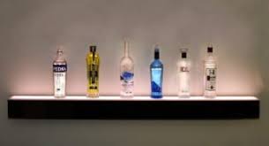 A bottle wall is a wall made out of glass or plastic bottles and binding material. Wall Mounted Liquor Shelf More Space To Display Liquor Bottles