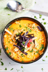 Top each bowl with cheddar cheese, sour cream, and crushed tortilla chips. Slow Cooker Creamy Chicken Tortilla Soup Recipe Easy And Frugal