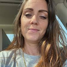 There's a mother raccoon with 4 babies in my yard. They are old enough to  eat themselves, but one is hurt bad. "He's" dragging his back legs and they  are almost raw