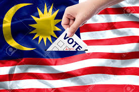 A malaysia country profile with facts and figures, official web sites of malaysia, links and information on malaysia's art, culture, geography, economy, history, travel and tourism, cities, the capital of malaysia, airlines, embassies, universities, tourist boards and newspapers. Malaysia General Election Concept Close Up Hand Of A Person Casting A Ballot At Elections During Voting On Canvas Malaysia Flag Background Stock Photo Picture And Royalty Free Image Image 105669492
