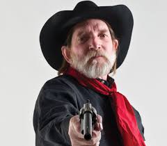 He's got the look: Perkins is driver, minister, gunfighter and more