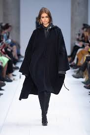 Tailored from sumptuously soft camel hair, this timeless coat features wide shawl lapels that drape into a generous, cozy hood. Mfw Max Mara Fall Winter 2020 21 Womenswear Collection