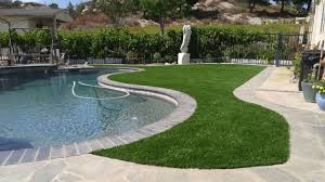 What is the best material to use around a pool? Premium Platinum Artificial Turf Surrounding The Pool Backyardideas Poolideas Concrete Gogreen Turf Backyard Swimming Pools Backyard Inground Pool Plants