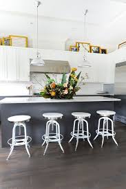 Decorating Above Kitchen Cabinets What S In What S Out In 2020 Above Kitchen Cabinets Decorating Above Kitchen Cabinets White Modern Kitchen