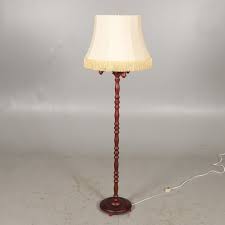 The features include a dark stained mahogany finish applied by experts. Floor Lamp 3 Armed Mahogany Stained Wood Lighting Lamps Floor Lights Auctionet