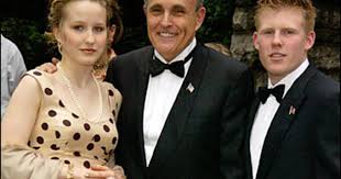 Giuliani has subsequently brushed off the controversy over his physical actions in the scene, claiming that he was merely tucking in his shirt when he lay across the bed in the room. Giuliani Estranged From His 2 Children Cbs News