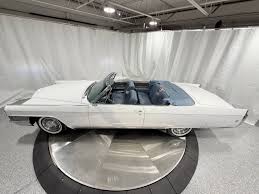 Image result for Starlight Silver 1965 Cadillac