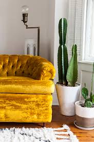 The cushioned arms provide added comfort while the small scale tufting adds a pop of personality. Home Tour Marianne Brown S Denver Dwelling House Of Hipsters Vintage Home Decor Home Decor Creative Home Decor