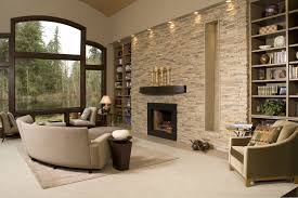 Contemporary Living Room With Stacked Stone Accent Wall Recess Lighting And A Fireplace Fireplace Accent Walls Accent Walls In Living Room Stone Accent Walls